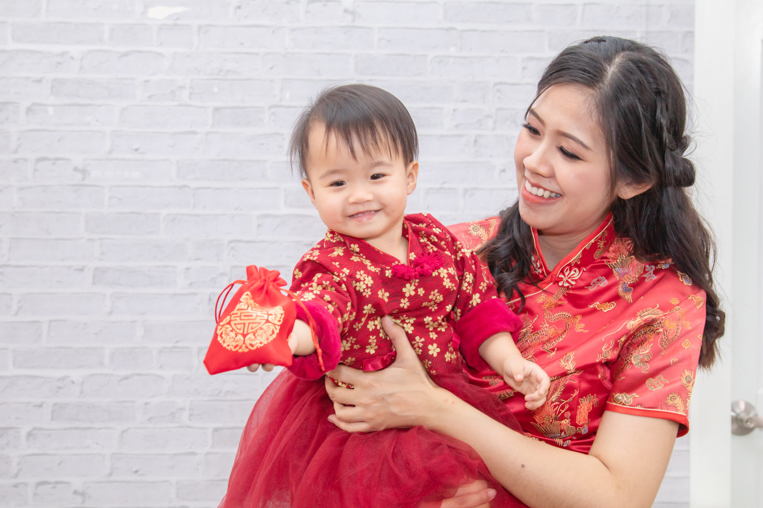 A Mommy and Baby in Traditional Chinese Clothing